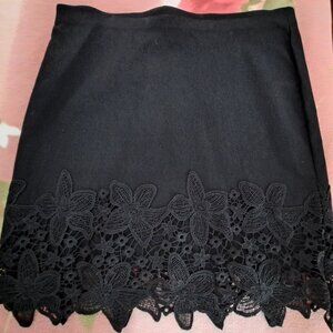 BCX stretch Black Mini skirt -Floral lace trim
